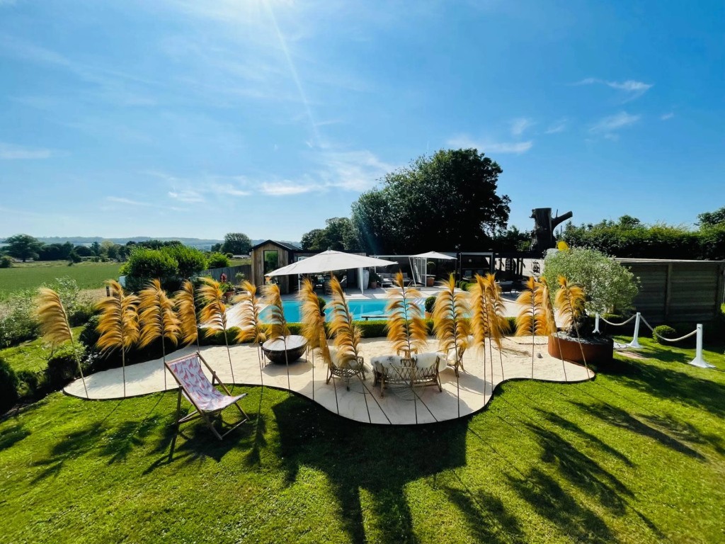 Wide view of Red House Beach Pool and garden